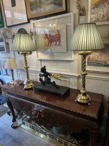 A pair of brass 19th century table lamps candlesticks, converted to electricity