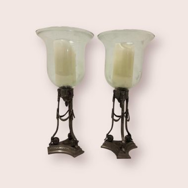 PAIR OF CAST METAL AND GLASS CANDLEHOLDERS